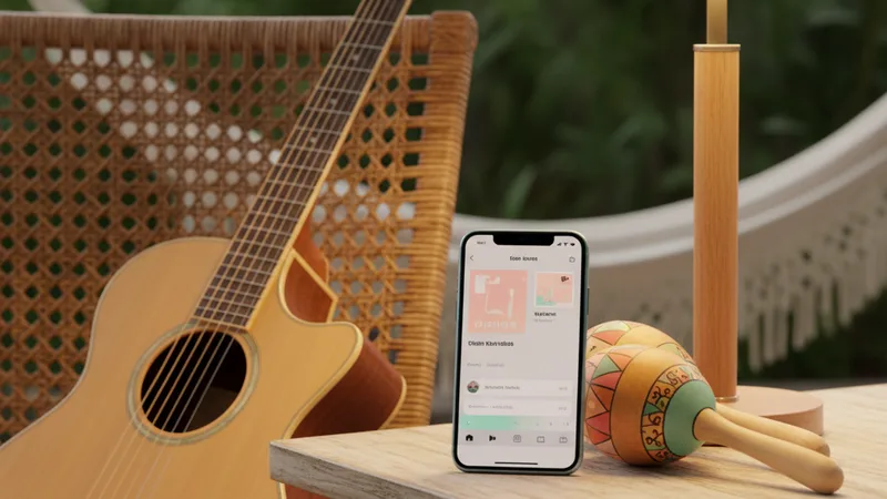 Close-up of an acoustic guitar leaning against a chair, a pair of maracas on a wooden table, an iPhone showing a music app, soft warm lamp light, candid still-life photography in editorial style, warm tropical pastel tones